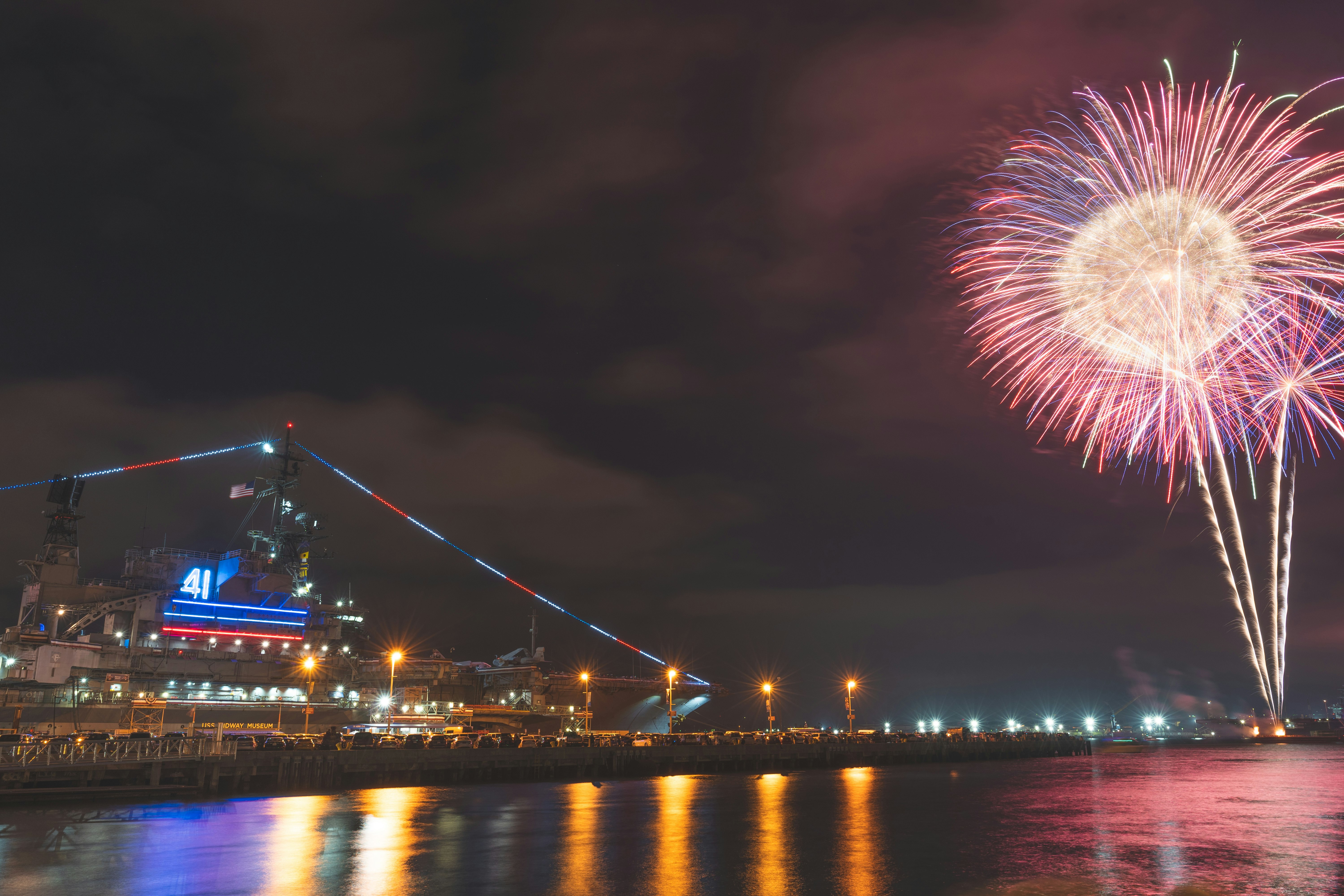 fireworks display over body of water during night time